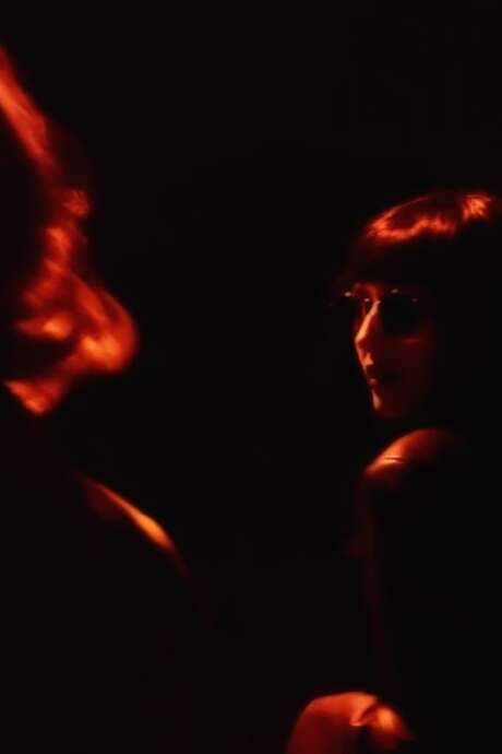 A woman discovers she can see glimpses of the future through her photographs, experiencing moments of distant happiness. However, she becomes trapped in a recurring cycle, struggling to understand the visions and their implications. The ability offers a tempting connection to what might be, but also presents a perplexing challenge.